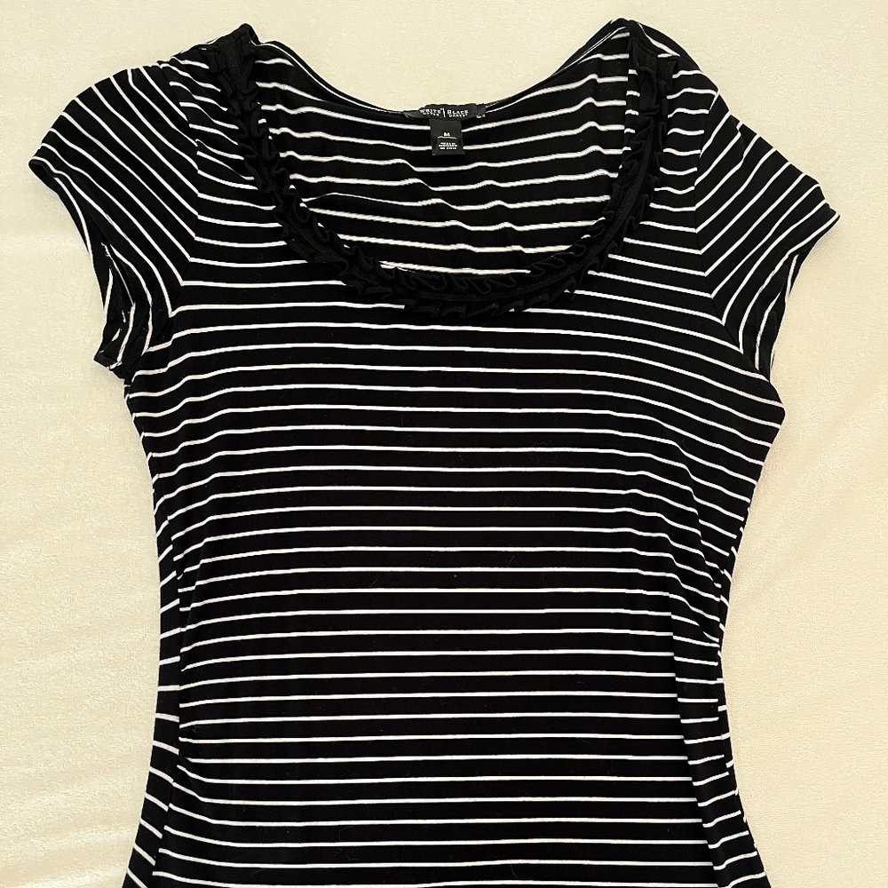 Black white striped top with ruffle trim